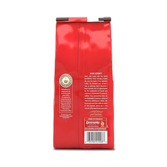Red coffee bag with text and a logo on a white background