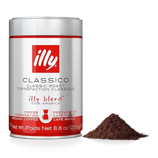 Illy coffee can with ground coffee on a white background