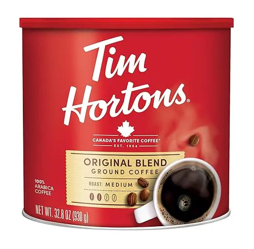 Red can of Tim Hortons Original Blend ground coffee with a white label.